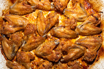 Grilled chicken wings in a baking sheet