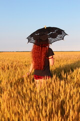 girl in golden wheat field