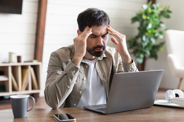 Man Working on Laptop Computer, Have Difficulties