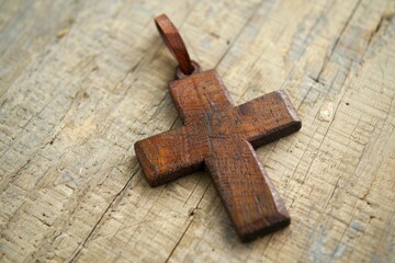 Background, religion, and closeup of wooden cross on table for prayer, Jesus' resurrection, and worship. Christian faith, crucifix for holy spirit, paradise, or spiritual trust