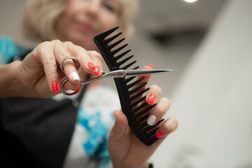 Hairdresser's comb and scissors crossed with each other