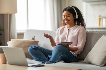 Young black woman attending webinar from home