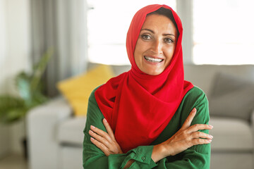 Cheerful Woman Wearing Red and Green Hijab