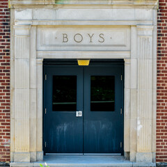 'Boys' exterior entrance to an old school building.