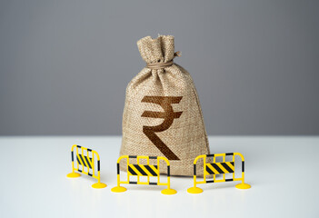 Indian rupee bag is fenced with barriers. Capital restrictions. Prevent rapid fluctuations in...