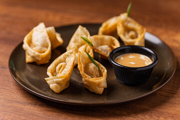 Tequeños stuffed with lomo saltado with guacamole sauce