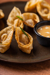Tequeños stuffed with lomo saltado with guacamole sauce