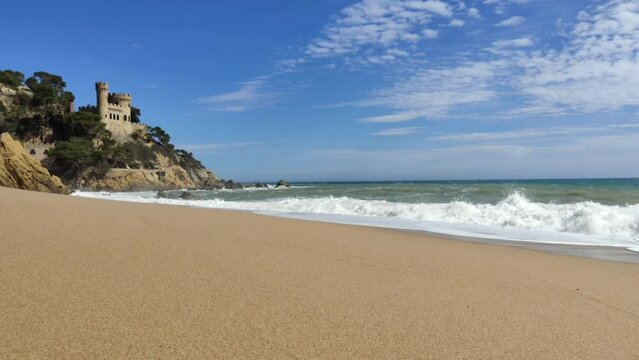 Lloret de Mar, a popular tourist resort on the Costa Brava, Catalonia, Spain. Video made in spring with a high swell.
