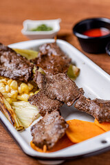 Peruvian anticuchos, juicy and seasoned, fresh from the grill.