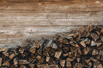 Chopped firewood pile. Woodpile board wall. Wood. Old dry pine wooden heap. Brown color textured...