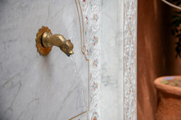 Water fountain with Islamic art ornament in Marrakech