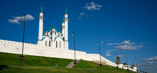 Kazan Kremlin in summer, Tatarstan, Russia. Panorama of white wall and towers of old city under blue sky. Concept of UNESCO site, travel and landmark.