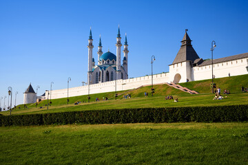 Kazan Kremlin in summer, Tatarstan, Russia. Panorama of white wall and towers of old city under blue sky. Concept of UNESCO site, travel and landmark.