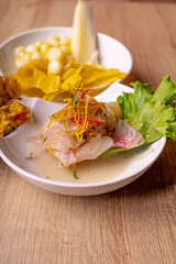 Peruvian food, seafood trio. on wooden table.