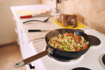 Vegetable side dish stewed in a frying pan on the stove