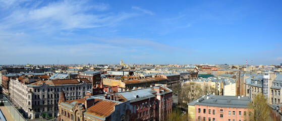 Panorama of the roofs of St. Petersburg, the golden domes of the Cathedral of the Vladimir Icon of...