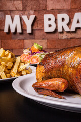 Peruvian grilled chicken, with fries and salad.