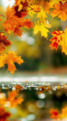 autumn leaves frame with close up of  leaves over a lake with reflection and bokeh of water in the background