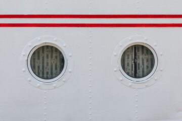 round windows in a passenger ship - cabin windows  - 799374687