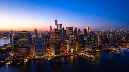 Beautiful city view with multiple lights on. New York panorama from drone photo above the East...