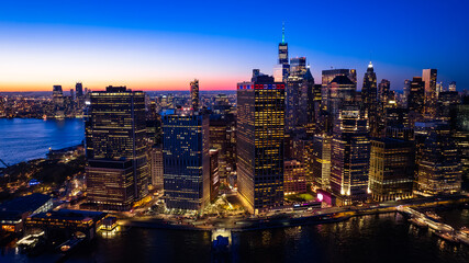 Beautiful city view with multiple lights on. New York panorama from drone photo above the East...