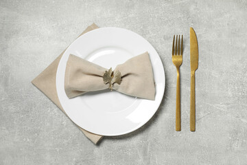 Stylish setting with elegant cutlery on grey table, flat lay