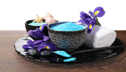 Light blue sea salt in bowls, flowers, starfish, seashell and towel on wooden table against white...