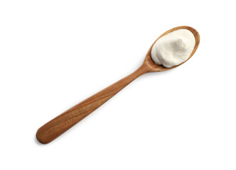 Sour cream in wooden spoon isolated on white, top view