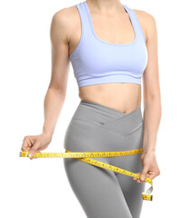 Woman with measuring tape showing her slim body on white background, closeup