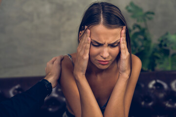 Psychiatrist comforting and supporting stressed and depressed patient with mental illness and...