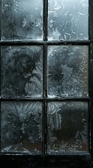 Black wooden framed window covered in frosty ice crystals