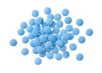Heap of blue tablets isolated on a transparent background. Top view. Stock photo.