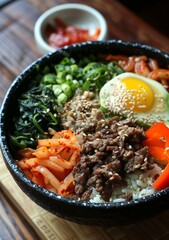Korean Food Bibimbap With Rice, Beef, Egg and Vegetables