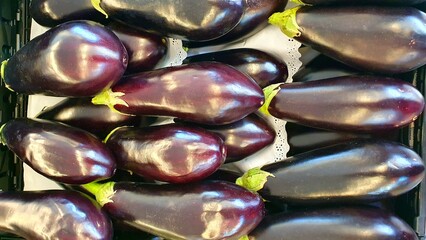 Eggplant close-up. Vegetable eggplant. Selling and buying vegetables in a store, supermarket, market, fair. Eggplants on display.