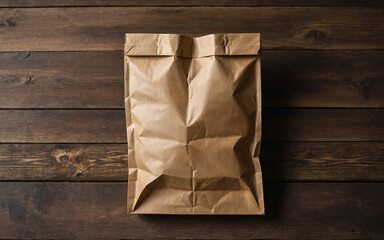 A brown paper bag is sitting on a wooden table
