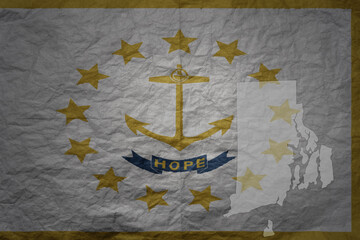 big national flag and map of rhode island state on a grunge old paper texture background
