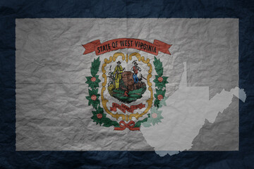 big national flag and map of west virginia state on a grunge old paper texture background