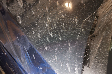 Applying protective film to car hood for added durability