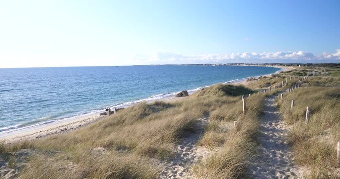 The coast at Pen Bron and the blue water of the Atlantic ocean. La Turballe, France - April 28, 2024.