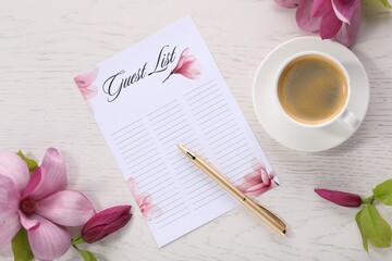 Guest list, coffee, pen and beautiful flowers on white wooden table, flat lay. Space for text