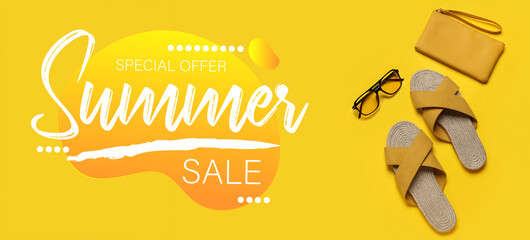 Stylish yellow sandals with purse and sunglasses on color background