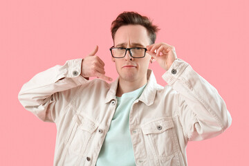 Confused young man showing 