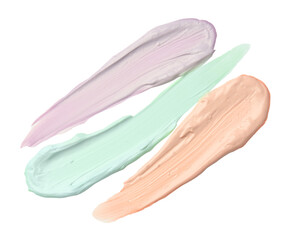 Strokes of pink, green and purple color correcting concealers on white background, top view