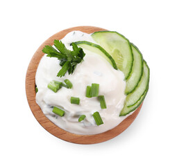 Delicious yogurt with green onion, cucumbers and parsley in bowl isolated on white, top view