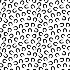 Black and white seamless pattern of shod horse hoof prints in silhouette. Equine footprints. Horseshoes of pony, donkey, mule. Shod hooves. Isolated on white background. Print, textile, wrapping paper