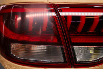 Transformative before and after shots of tail light repainting on a car