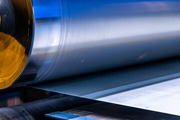 Gleaming Steel Symphony: A Close Up of a Roll of Metal