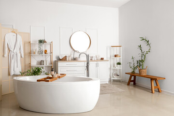 Bathtub with bathtub tray in interior of bathroom