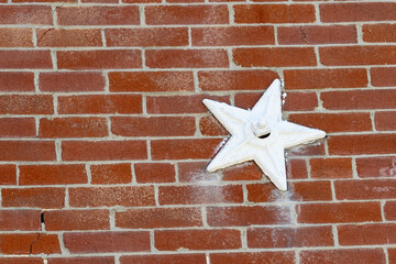 red brick wall with star