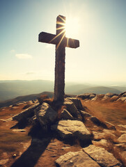cross on the hill with bright sun